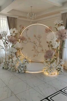 a white room with flowers and lights on the floor