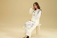 Brand: NishatCollection: Nishat Any Day Winter Unstitched CollectionFabric: Karandi DESIGN DETAILS: SHIRTSolid Premium Karandi Shirt: 3 MeterEmbroidered Front + MotifsFabric: KarandiColor: Off White TROUSERSSolid Premium Karandi Trousers: 2.5 MeterFabric: KarandiColor: Off White DISCLAIMER:* Lining, Laces, and Tassels are not included in unstitched variants.* Embellishment items in stitched outfits are subject to market availability.* The actual colors of the outfit may vary from the colors being displayed on your device. CARE INSTRUCTIONS: Extra Fabric Has Been Used For Shoot Original Color May Vary Slightly From The Picture Dry Clean Recommended Iron The Clothes At Moderate Temperature Do Not Use Bleach, Or Stain Removing Chemicals Damp Fabric Should Not Be Exposed To Sunlight Nishat Any Fitted White Sets With Embroidered Sleeves, White Sets With Embroidered Sleeves For Eid, Extra Fabric, Fabric Stores Online, Jacquard Fabric, Product Label, Designer Suits, Fabric Store, Best Sellers