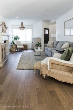 a living room filled with furniture and a fire place in the middle of a room