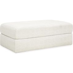 a white footstool sitting on top of a white floor