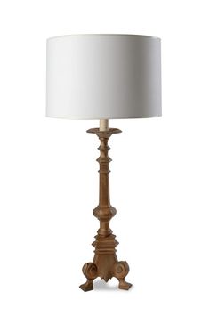 a wooden table lamp with a white shade on the top and bottom part of it