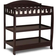 a wooden baby crib with two shelves on each side and one shelf below it