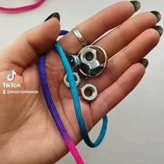 a person holding several different colored bracelets in their hand with the caption tik tok