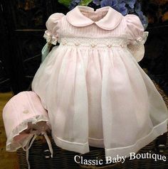 Back in stock!! Stunning arrival from boutique designer Will'beth. Gorgeous bright pink dress with white poly sheer overlay creates a beautiful vintage look. Wh Smocking Baby, Smocked Baby Girl Dresses, Bright Pink Dress, Bright Pink Dresses, Smocked Baby Dresses, Heirloom Dresses, Pink Sheer, Sheer Overlay, Christening Gowns