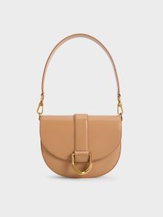 Make space in your wardrobe for this latest addition to the Gabine family, and especially in this beautiful toffee hue that will complement a wide array of outfits from brunch to work. Its iconic design remains unchanged, from the U-shaped buckle to the classic saddle silhouette, along with the single handle, which can be swapped for a longer shoulder strap for hands-free convenience and versatile styling options. Belt Ring, Leather Saddle Bags, Of Outfits, Charles Keith, Iconic Design, Kids Sale, Saddle Bag, Toffee, Belt Size