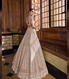 Seema Gujral Lehenga, Festive Floor-length Beige Lehenga, Anarkali Style Beige Choli For Reception, Beige Anarkali Floor-length Choli, Glamorous Anarkali Set With Intricate Embroidery For Reception, Beige Floor-length Gown With Sheer Dupatta, Beige Choli With Sheer Dupatta For Reception, Traditional Embellished Beige Lehenga, Embellished Beige Sharara For Reception