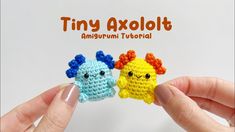 two small crocheted toys are being held by someone's hands with the words tiny