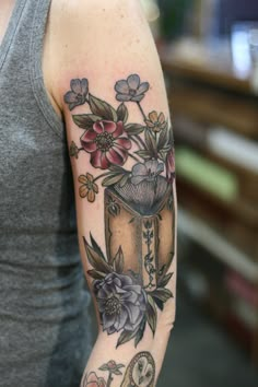 a woman's arm with flowers on it and the words instagramm written below