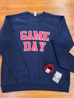 Show your team spirit with this cozy and comfortable navy with red and white Game Day crewneck sweatshirt! Perfect for any sport and all year round! Made on a cozy unisex crewneck sweatshirt in sizes small to 2xl. Navy Sweatshirt, Team Spirit, Game Day, Crewneck Sweatshirt, Red And White, Crew Neck Sweatshirt, Crew Neck, Navy, Sweatshirts