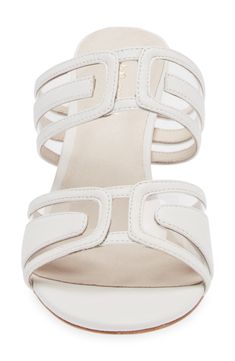 Elaborately cutout straps with transparent windows lend geometric flair to a smooth leather slide sandal lifted by an ultraslender stiletto heel. 3" heel (size 7) Leather and synthetic upper/leather lining/leather sole Imported Modern Sandals With 4-inch Heel For Formal Occasions, Modern White Sandals With 4-inch Heel, Modern Leather Sandals With 4-inch Heel, Modern White Heels With Heel Strap, Modern Synthetic Sandals With 4-inch Heel, Modern White Evening Sandals, Modern White Open Toe Heels, Modern Sandals With 4-inch Heel For Formal Events, Modern Heels With Heel Strap