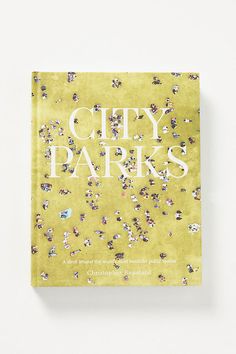 the cover of city park's book, with many small flowers on yellow paper