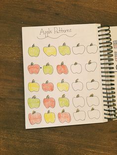 an apple pattern is shown on top of a notebook