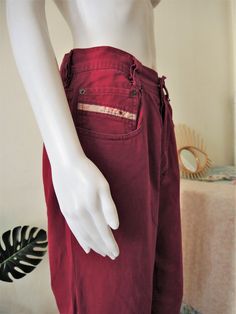 Vintage Diesel jeans from the 1990s in an amazing wine red shade! Mid rise relaxed fit, soft cotton denim fabric. Classic five pocket style. Button fly. Diesel brand label on the right pocket. Tapered legs. Unisex. Made in Italy! Pair them with a 90s crop top or tuck in a t-shirt. BRAND: Diesel ERA: 1990s COLOR: Wine red FABRIC: 100% cotton SIZE: Waist 32 - please check the measurements below as Diesel jeans are not always true to size! MEASUREMENTS: Waist 39cm, rise 33cm, inner leg 70cm, total Casual Burgundy Straight Leg Jeans, Burgundy Straight Leg Cotton Jeans, Burgundy Cotton Straight Leg Jeans, Burgundy Straight Leg Cotton Bottoms, Burgundy Cotton Straight Leg Bottoms, 90s Style Red Cotton Jeans, 90s Red Straight Leg Jeans, 90s Crop Top, Diesel Brand