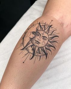 a sun and moon tattoo on the arm