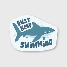 a sticker that says just keep swimming with a shark in the water on it