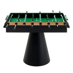 a foosball table sitting on top of a black pedestal with green and gold trim