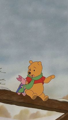 winnie the pooh and piglet are sitting on a tree branch with snow in the background