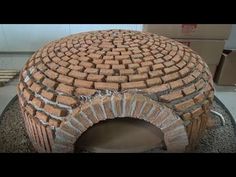 a brick oven sitting on top of a table