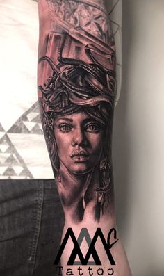 a woman with a snake on her head and an arm is shown in black ink