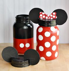 a red and white minnie mouse jar with polka dots on it, next to a black mickey