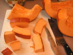 a cutting board topped with sliced up pumpkins