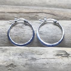 "The perfect everyday accessory, these glistening hoop earrings are made from 925 Sterling Silver. if you want something not too small or not too big, this is perfect for you! These hoops are 0.78\" (20mm) in length and width. SOLD AS A PAIR For more Silver Earrings: http://etsy.me/2AJWHDP ENTER MY SHOP HERE: KalismaBijoux.etsy.com HANDMADE by ME - All my work is crafted with the utmost care in my studios - in Madrid, SPAIN CHANGES Don't hesitate to contact me if you have an idea or request. ABO Small Silver Oxidized Hoop Earrings, Small Silver Hoop Earrings Hallmarked, Sterling Silver Round Hallmarked Hoop Earrings, Silver Tarnish-resistant Sterling Silver Hoop Earrings, Silver-plated Cubic Zirconia Hoop Earrings, Peace Earrings, Bali Earrings, Simple Hoop Earrings, Hoop Earrings Silver