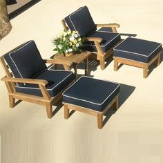 four chairs and a table near a swimming pool