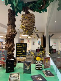 there are many books on the table in this library and it is decorated with flowers