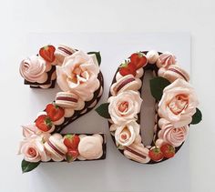 a cake shaped like the number twenty with flowers on it