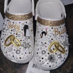 a pair of white and gold wedding shoes