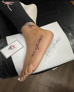 a woman's foot with her name tattooed on it