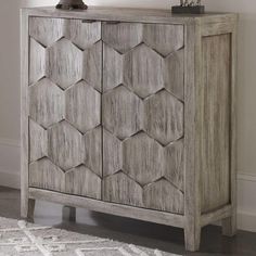 the sideboard is made out of wood and has hexagonal design on it