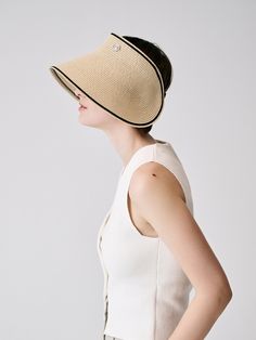 Editor's Notessieor presents unique and stylish hats that add a cute accent to your look. - Visor hat style- Made of raffia fabric- Long and wide curved visor- Contrasting edge line- Vintage button embellished- Vintage and trendy mood Measurements (in.)One Size- Visor: 5.12 in.- Depth: 7.09 in.- Circumference: 22.05 ~ 24.41 in. Composition & Care- Material: 100% Raffia- Avoid direct heat and moisture- Natural dry in the shade if wet- Do not bleach- Do not iron- Do not dry Chic Sun Hat With Uv Protection And Curved Brim, Chic Cream Straw Hat, Chic Brimmed Sun Hat With Uv Protection, Chic Beige Vacation Hat, Beige Straw Hat With Curved Brim For Spring, Chic Short Brim Sun Hat With Uv Protection, Beige Spring Straw Hat With Curved Brim, Chic Sun Hat With Uv Protection And Short Brim, Chic Visor Boater Hat For Vacation