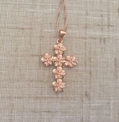 Solid .925 Large Sterling Silver with Rose Gold overlay Hawaiian 3-D Cross Plumeria Necklace. The size is 32x22MM plus the 7MM bail. Just stunning in person, it is designed to mimic the look of fine jewelry at a fraction of the cost. FREE Italian Sterling Silver Rose box chain included. The cross features six 8MM Plumerias with Sandblasted Matte centers and High-Polished shiny edges. --The Plumeria is iconic of Hawaiian culture. It's bright colors and magnificent scent greet both visitors and lo Rose Gold Cross Pendant Necklace For Gift, Rose Gold Cross Jewelry For Mother's Day, Rose Gold Cross Necklace For Gift, Sterling Silver Rose Design Jewelry For Gift, Rose Gold Jewelry With Hallmark For Gift, Rose Gold Jewelry Gift With Hallmark, Rose Gold Jewelry With Rose Design For Anniversary Gift, Rose Gold Jewelry With Rose Design For Anniversary, Rose Design Rose Gold Jewelry For Anniversary Gift