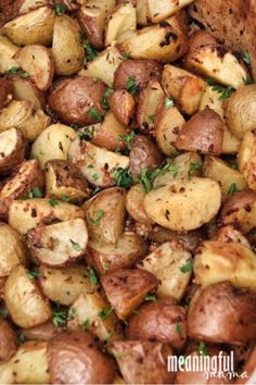 cooked potatoes with herbs and seasoning in a dish