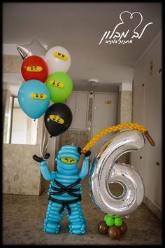 an image of a man with balloons in the shape of numbers 6 and six on his face