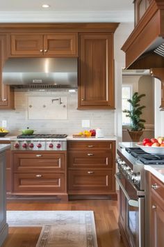 a kitchen with wooden cabinets and stainless steel appliances