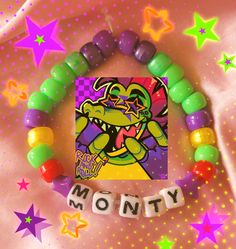 a bracelet with beads and an image of a cartoon character on it