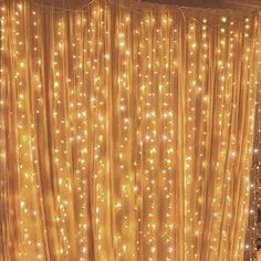 the curtains are covered with lights in this room