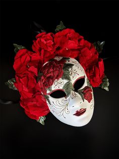 Embrace timeless elegance with this Red Rose Floral Mask, featuring intricate embroidery and vibrant red roses. Inspired by Venetian mask-making traditions, this stunning mask is perfect for masquerade balls, themed parties, or theatrical events. The luxurious red floral accents combined with the delicate embroidery make this mask a captivating statement piece.

Age Group/Gender - Adult/Women

Size/Type - One size fits all adults

Mask Color - Red/White

Mask Material - Polyresin

Special Featur Day Of The Dead Masks, Kids Party Packs, Masquerade Mask Women, Couples Masquerade Masks, Floral Mask, Rose Mask, Red Mask, The Day Of The Dead, Female Mask