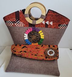 An authentic handbag  handmade with wood, beads and fabric.  Unique and stylish one of a kind. Zipper enclosure and zipped pocket inside. Made by local artisans in Kenya, Africa. Brown Bags With Wooden Handle For Everyday Use, Ankara Bags, African Basket, Handmade Handbag, African Baskets, Denim Diy, Handmade Handbags, Fabric Bags, Local Artisans