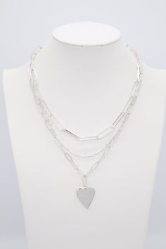 This necklace is a fun accessory to wear every day! It's a silver chain with a heart charm. The heart charm is a great way to add a little bit of romance to your outfit. Trendy Silver Charm Necklace For Valentine's Day, Silver Charm Necklace For Valentine's Day, Trendy Silver Open Heart Necklace, Trendy Silver Charm Necklace With Heart Charm, Silver Layered Heart Necklace For Gifts, Silver Heart-shaped Layered Necklace As A Gift, Trendy Silver Necklace With Heart Charm, Silver Heart-shaped Layered Necklace For Gifts, Silver Heart-shaped Layered Necklace Gift