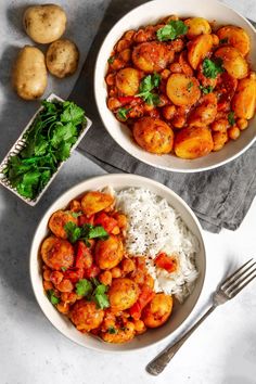 two bowls filled with shrimp and rice on top of a white table next to potatoes