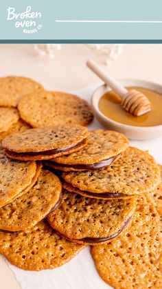 crackers and honey are sitting on a table