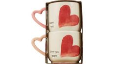 two coffee mugs with hearts painted on them