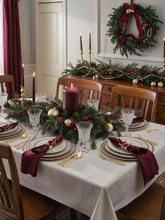 a dining room table set for christmas dinner