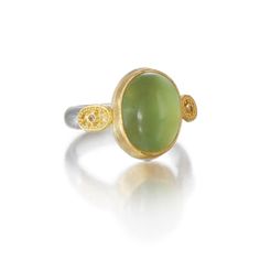 Gold, Silver & Stone Ring - Greek goddess Gaia, ancestralmother of the Earth, is the inspirationfor this exquisite ring. Its enchantingprehnite cabochon is set in 22K goldand fl anked by granulated ovals,while the 0.15W band is brushedsterling silver. Whole and half sizes6-12. Exquisite Green Cabochon Ring, Yellow Gold Peridot Rings With Gemstone Accents, Yellow Gold Chrysoprase Jewelry With Cabochon, Elegant Oval Chrysoprase Rings, Yellow Gold Emerald Chrysoprase Cabochon Ring, Heirloom Yellow Gold Moonstone Cabochon Ring, Luxury Oval Peridot Rings, Yellow Gold Chrysoprase Cabochon Ring, Unique Yellow Gold Oval Moonstone Ring