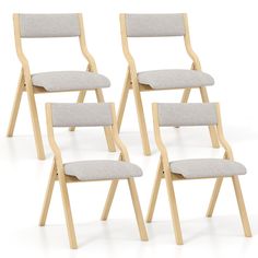 four wooden chairs with grey upholstered seats