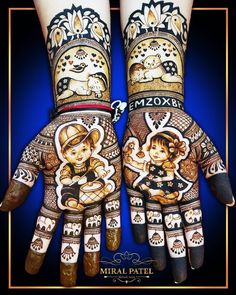 two hands painted with different designs on them