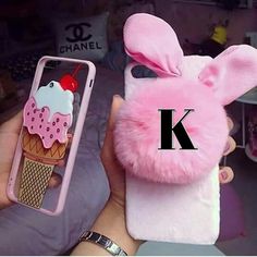 a person holding up a phone case with an ice cream cone and bunny ears on it